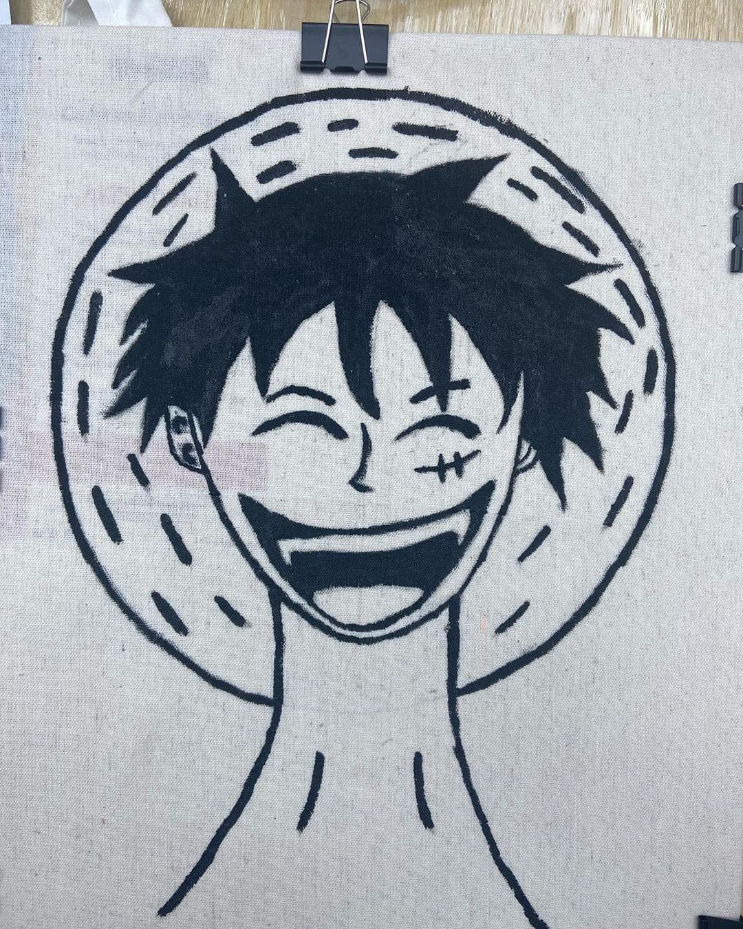 Hand-painted character art on a tote bag